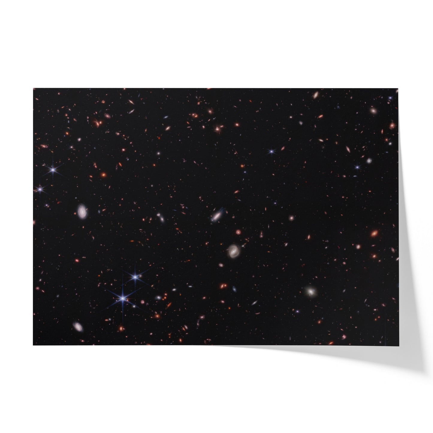 Hundreds of small galaxies against the black background of space