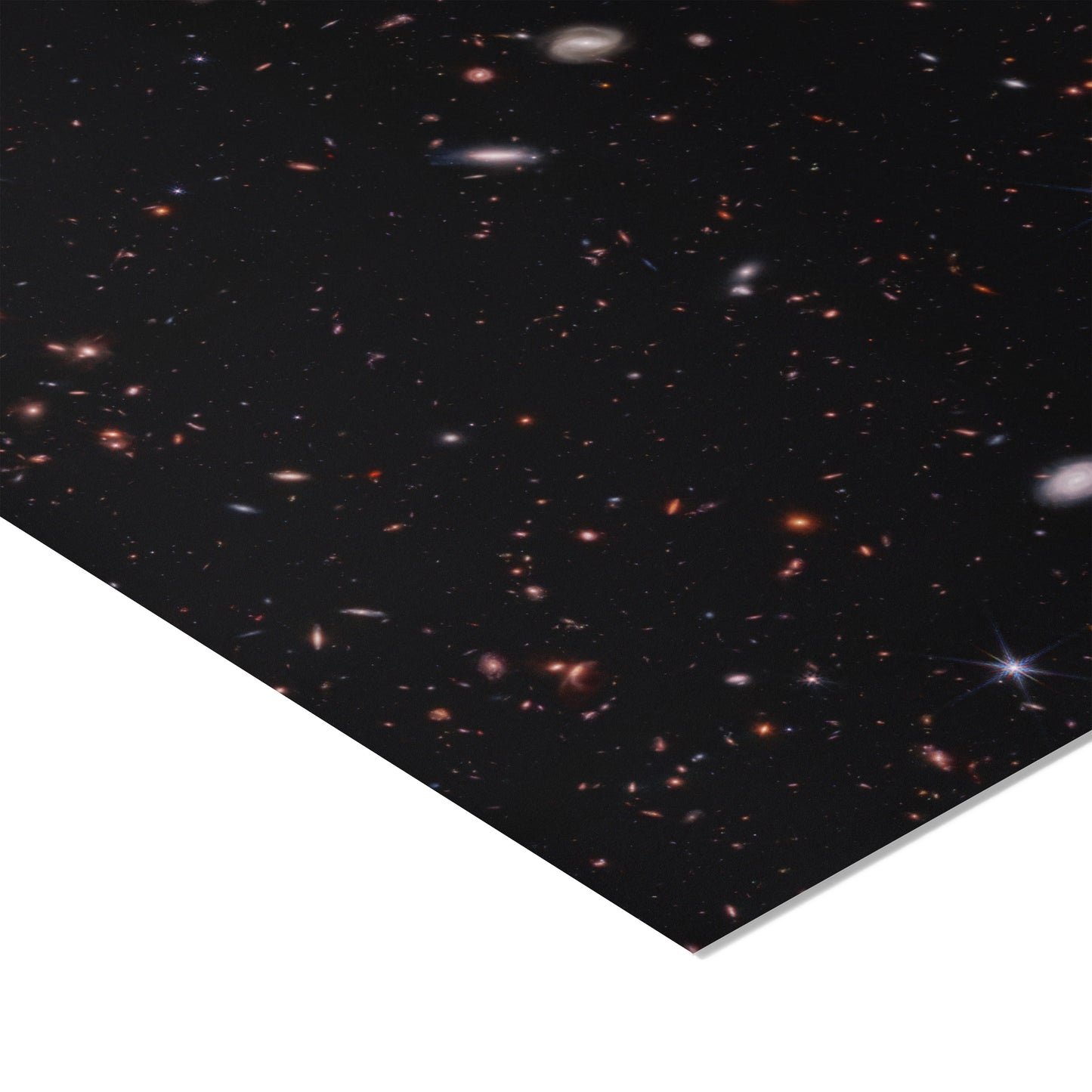 Hundreds of small galaxies against the black background of space