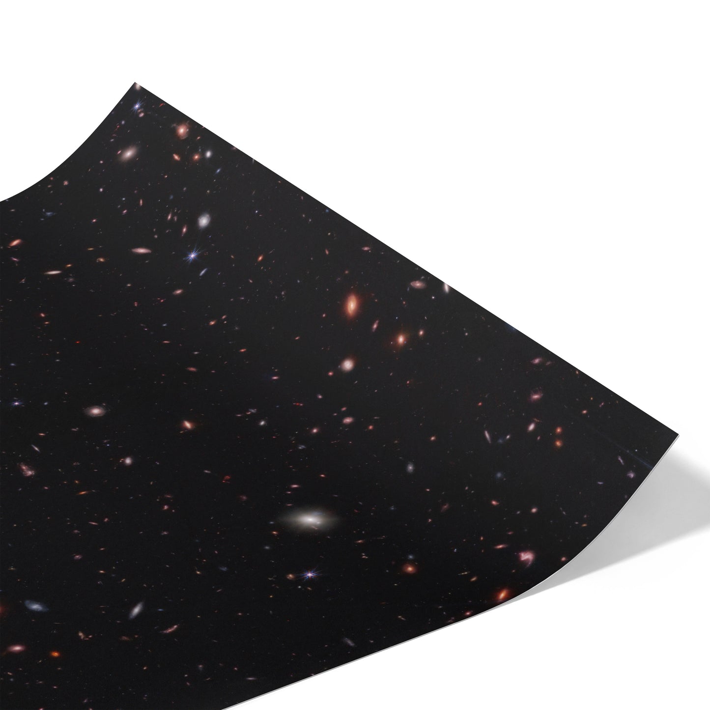 Hundreds of small galaxies against the black background of space