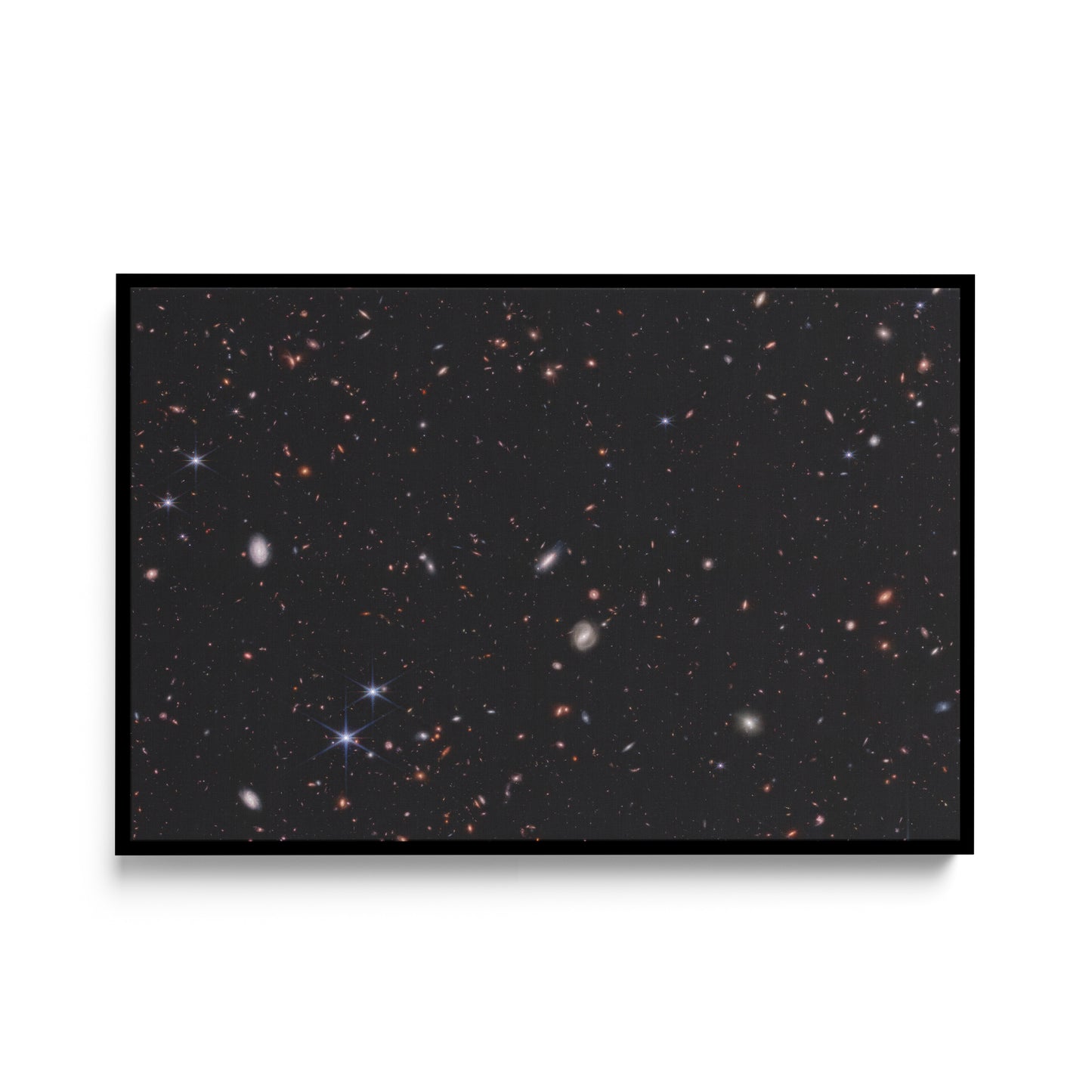 Hundreds of small galaxies against the black background of space